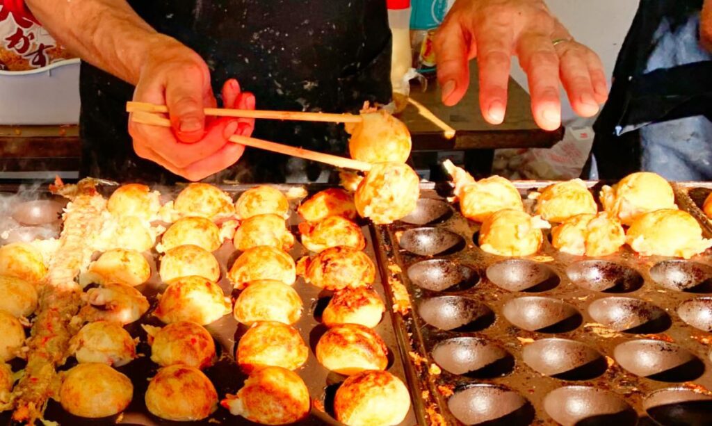 Takoyaki, crispy octopus balls served hot at a street stall in Tokyo.