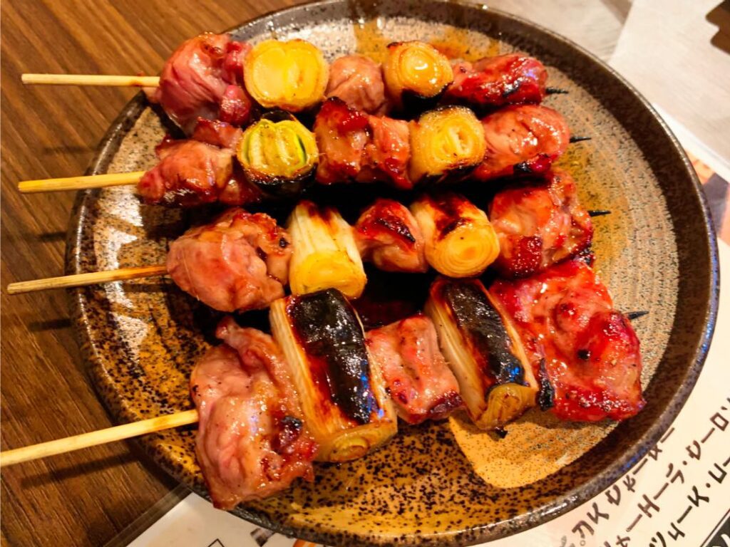 Yakitori, skewered and charcoal-grilled chicken seasoned with soy sauce, a Tokyo street food favorite.