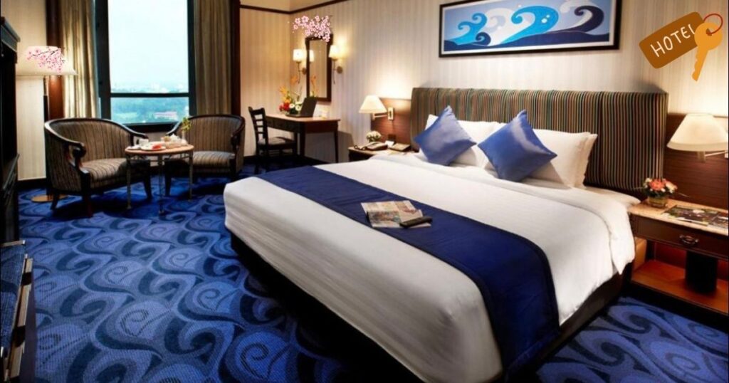 Japanese hotel room with a king-size bed, blue-themed decor, and a city view. Example of a mid-range to luxury hotel in Japan. Ideal for travelers looking for comfortable stays in Tokyo, Kyoto, or Osaka.